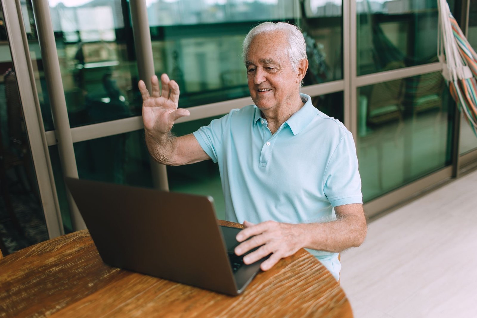 Veteran using a video call to manage VA disability benefits overseas from abroad