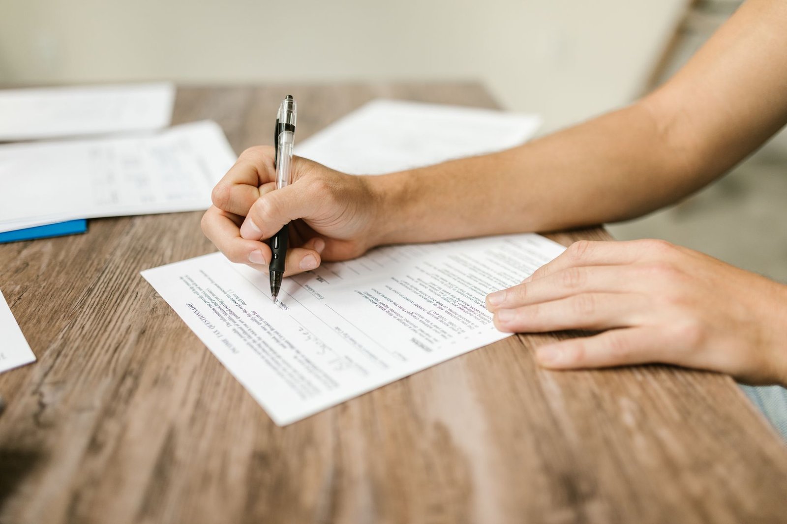 Hands completing an authorization form in response to VA claim development letters